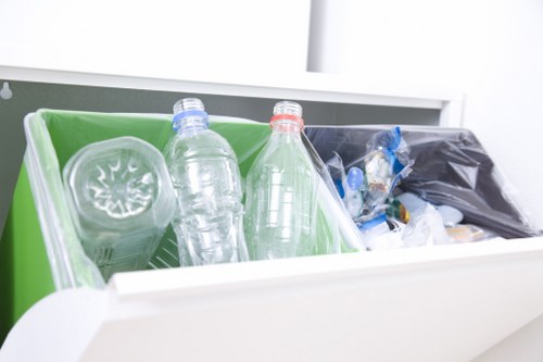 Recycling bins for household waste in Queens Park.